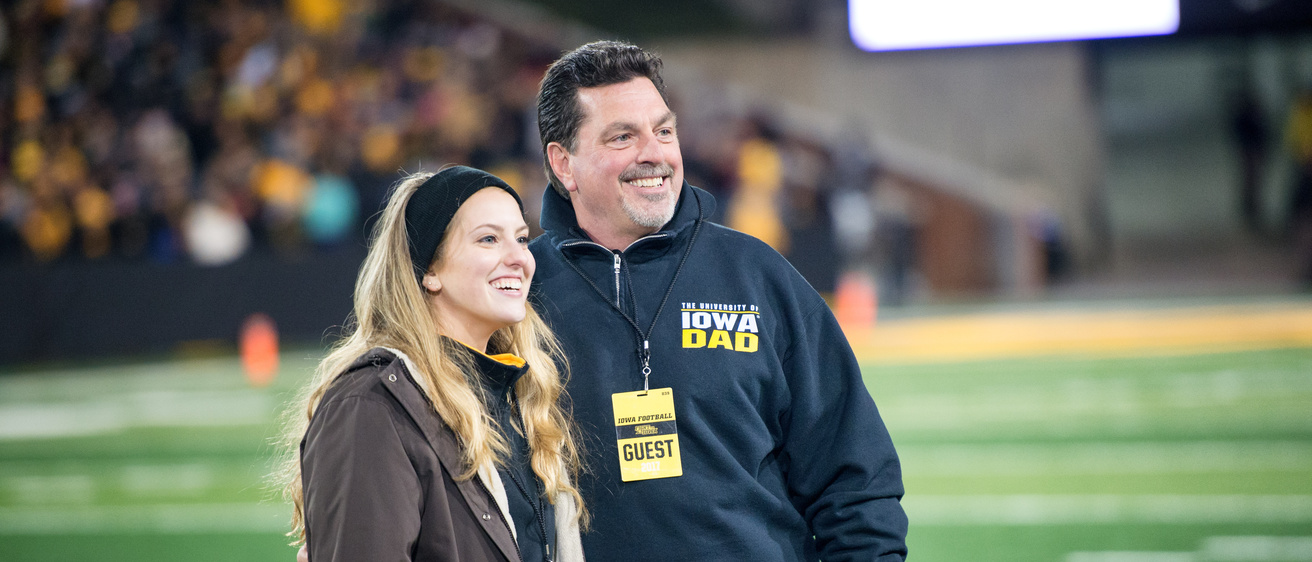 Iowa dad with daughter at Kinnick Stadium